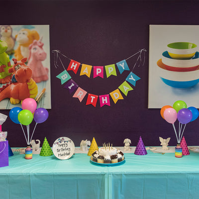 Beautiful table display for birthday party at paint your own pottery studio in Wisconsin Dells